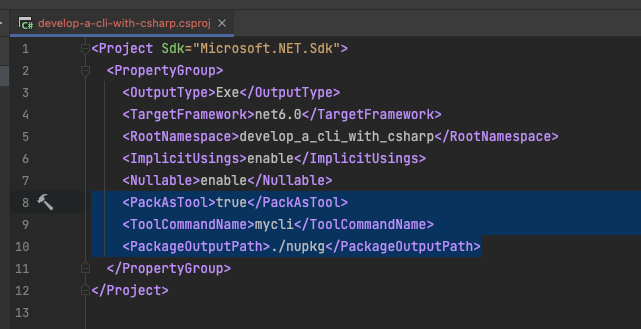 IDE showing .csproj file edited and new XML lines added